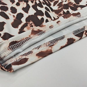 Detailed close-up showing precise double-needle stitching on leopard print sleeve cuff