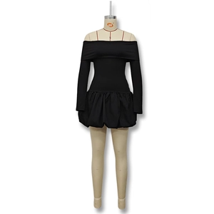 Detail view of the black off-shoulder dress featuring a structured bubble hemline design