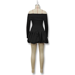 Detail of off-shoulder black mini dress with long sleeves and tiered bubble skirt hem