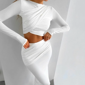 White ruched two-piece set featuring long sleeve crop top and slim maxi skirt for women