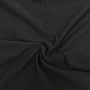 Detail view of black dress fabric with distinct twill texture and elegant drape