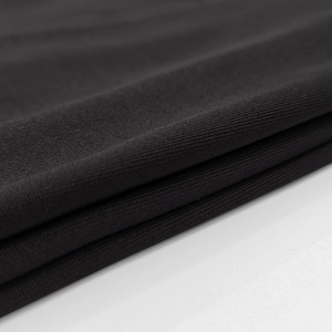Close-up of premium black knit fabric texture showing fine ribbed material detail