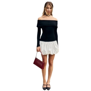 Off-shoulder long sleeve black top with white bubble skirt set for a chic look
