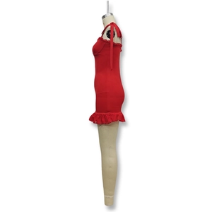 Detail of red slim fit mini dress with shoulder bows and elegant ruffled hemline
