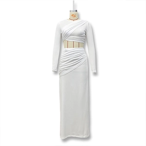 Detail of white two-piece set featuring long-sleeved crop top and ruched high waist skirt