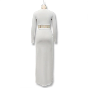 Rear view of white two-piece set featuring long sleeve crop top and slim maxi skirt