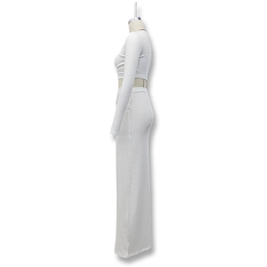 Close-up of the smooth white stretch fabric on the crop top and high-waist maxi skirt