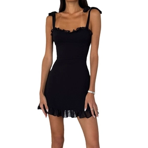 Slim fit black mini dress with adjustable shoulder bows and ruffled hem detailing