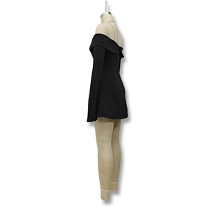 Detail of black off-the-shoulder long sleeve mini dress with a folded neckline design