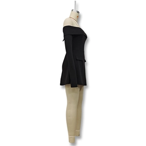 Detail view of black off-the-shoulder mini dress with elegant long sleeves and pocket flaps