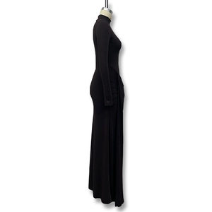 Detail showing the ruched design and elegant side folds of this black high-neck maxi dress