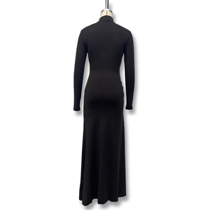 Detail view of the back of a slim-fit black turtleneck maxi dress with long sleeves