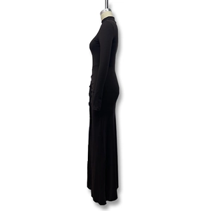 Detail view of the black high-neck maxi dress with a slim fit and sexy high side slit