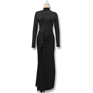 Close-up of black bodycon dress featuring elegant waist pleats and knot detail