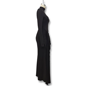Detailed side view of black high neck dress showing elegant waist pleats and ruching detail