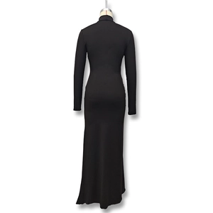 Detail view of black bodycon maxi dress featuring a high side slit and turtle neck