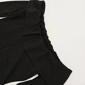Detail shot of the back collar and seamless zipper on a slim black A-line dress