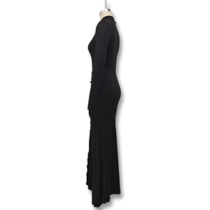 Detail view of black high-neck bodycon dress with side slit and long sleeves on mannequin