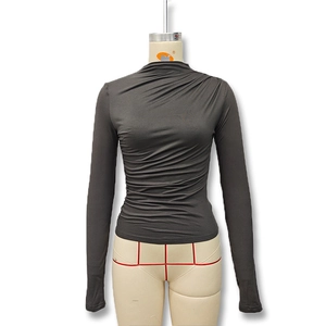 Detail of slim fit dark grey long sleeve top with stylish pleated turtleneck design