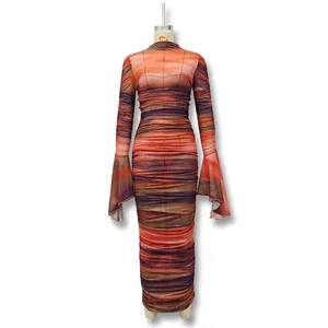 Detail view of the abstract tie-dye texture and ruching on this bodycon flared sleeve dress