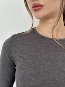 Detailed close-up of dark grey ribbed knit fabric texture and classic crew neckline