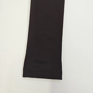 Detail of high-density knitted fabric sleeve cuff with professional double-needle stitching