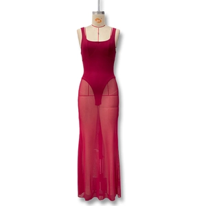 Detailed close-up of a red bodycon dress with sheer mesh skirt and sleek backless design