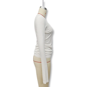 Detailed side view of a white slim fit top featuring a crew neck and flared long sleeves
