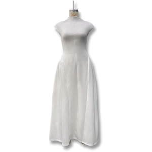 Detail view of white sleeveless maxi dress with cinched waist and elegant A-line silhouette