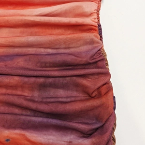 Macro detail of gradient mesh fabric with elegant ruching and textured pleats