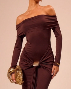 Detail of chocolate off-shoulder dress featuring waist pleats and gold square buckle
