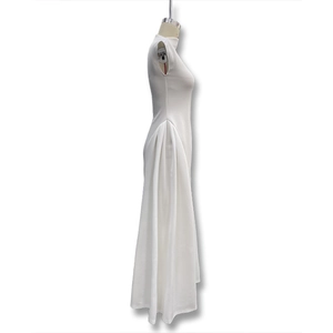 Detail view of the elegant draped side pleats on a white sleeveless maxi dress for women