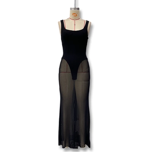 Detail of the sheer black mesh splice and slim fit sleeveless design on this maxi dress