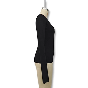 Side view of slim fit black long sleeve t-shirt with crew neck on mannequin display