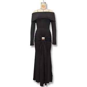 Detail of the waist ruching and gold buckle on a black off-shoulder fishtail dress
