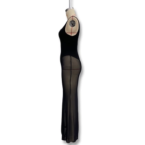 Detailed side view of black bodycon maxi dress with sheer mesh paneling and mermaid hem