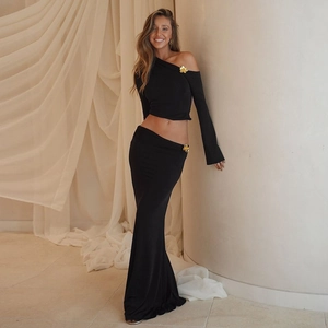 Elegant black two-piece set with asymmetrical shoulder top and high waist mermaid skirt