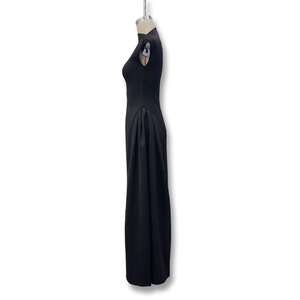 Detail of elegant black sleeveless evening dress showing side ruched draping on mannequin
