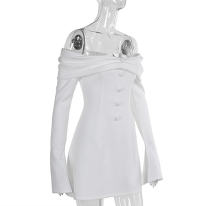 Detail of white off-shoulder mini dress featuring decorative buttons and sleek texture