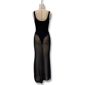 Detail showing sheer mesh patchwork and slim fit silhouette of the black maxi dress