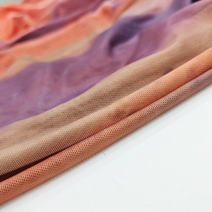 Detail of gradient orange and purple mesh fabric with fine breathable texture