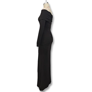 Detail view of the elegant black off-shoulder maxi dress featuring back ruched fabric