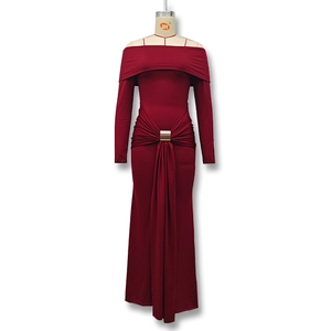 Detail of burgundy off-shoulder dress featuring waist pleats and a gold square buckle