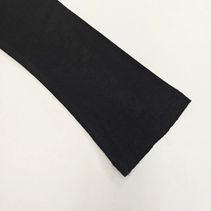 Close-up of black knit fabric showing premium stitching and fine ribbed texture