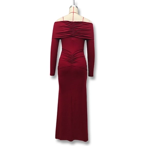 Detail view of burgundy off-shoulder maxi dress featuring back ruching and slim fit