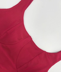 Macro detail of rose red mesh fabric stitching and seams on sexy backless dress