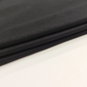 Close-up of high-quality black fine knit fabric texture for slim fit long sleeve top