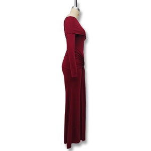 Detail view of side ruching on a deep burgundy off-shoulder evening maxi dress