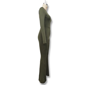 Side view of olive green slim fit long sleeve jumpsuit with flared legs on a mannequin