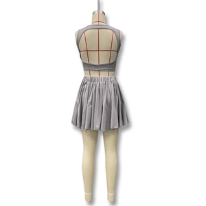 Back view of gray two-piece set featuring a backless crop top and elastic pleated mini skirt